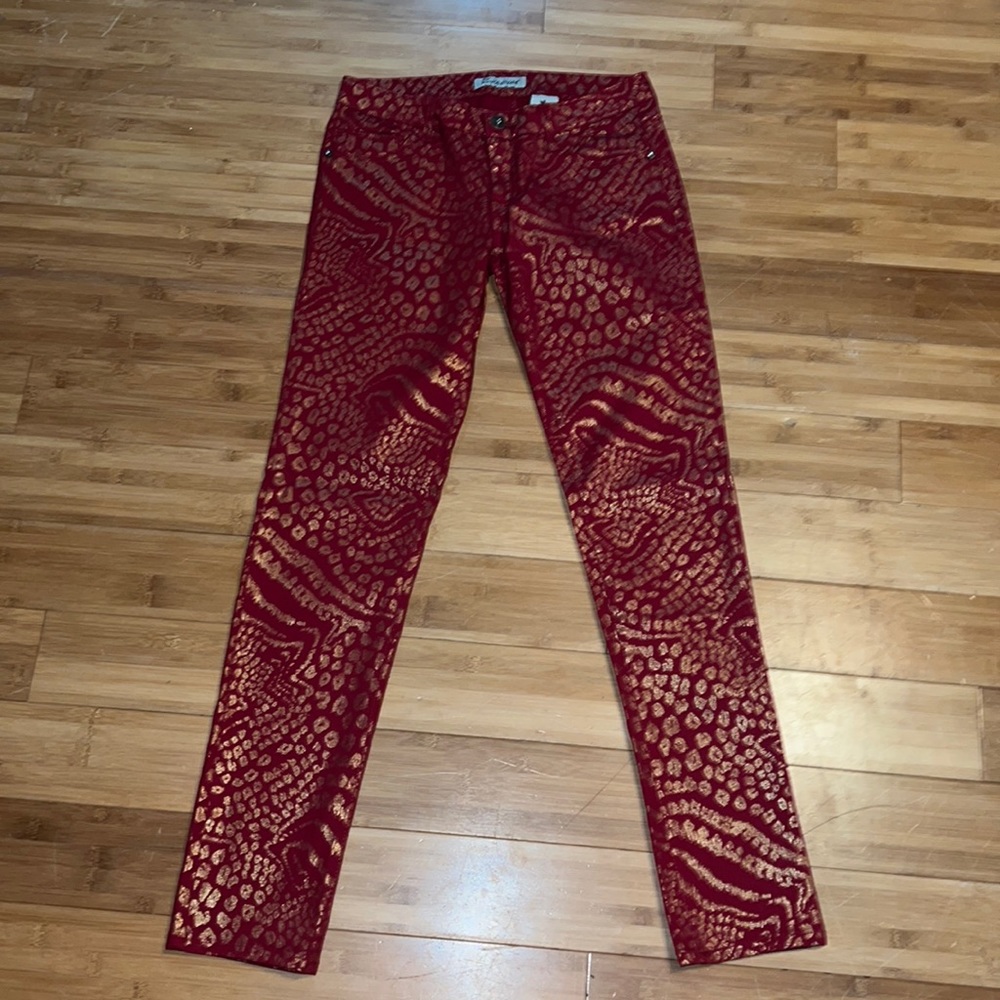 Women’s red jeans with leopard print.